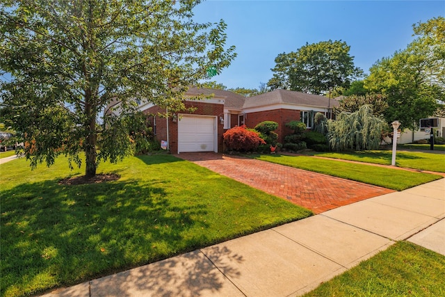 3458 Frederick St, Oceanside, NY 11572 - view of front of house with decorative driveway, brick siding, an attached garage, and a front lawn