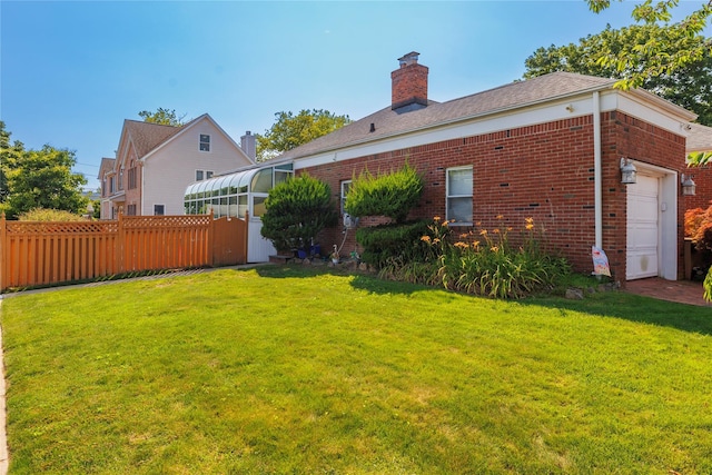 3458 Frederick St, Oceanside, NY 11572 - view of yard with a garage and a sunroom