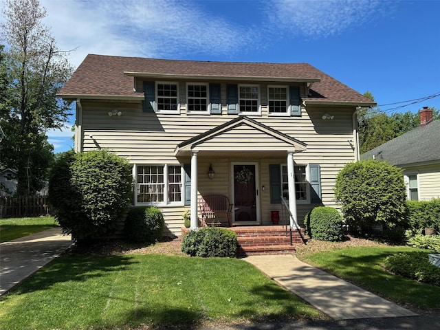 11 Berry St, Wallkill, NY 12589 - view of front of property featuring a front lawn, roof with shingles, and a porch