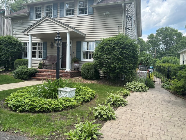11 Berry St, Wallkill, NY 12589 - view of front facade with covered porch and a gate