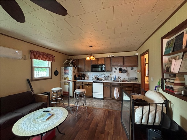 11 Berry St, Wallkill, NY 12589 - kitchen featuring white appliances, a wall mounted AC, light countertops, dark wood finished floors, and crown molding