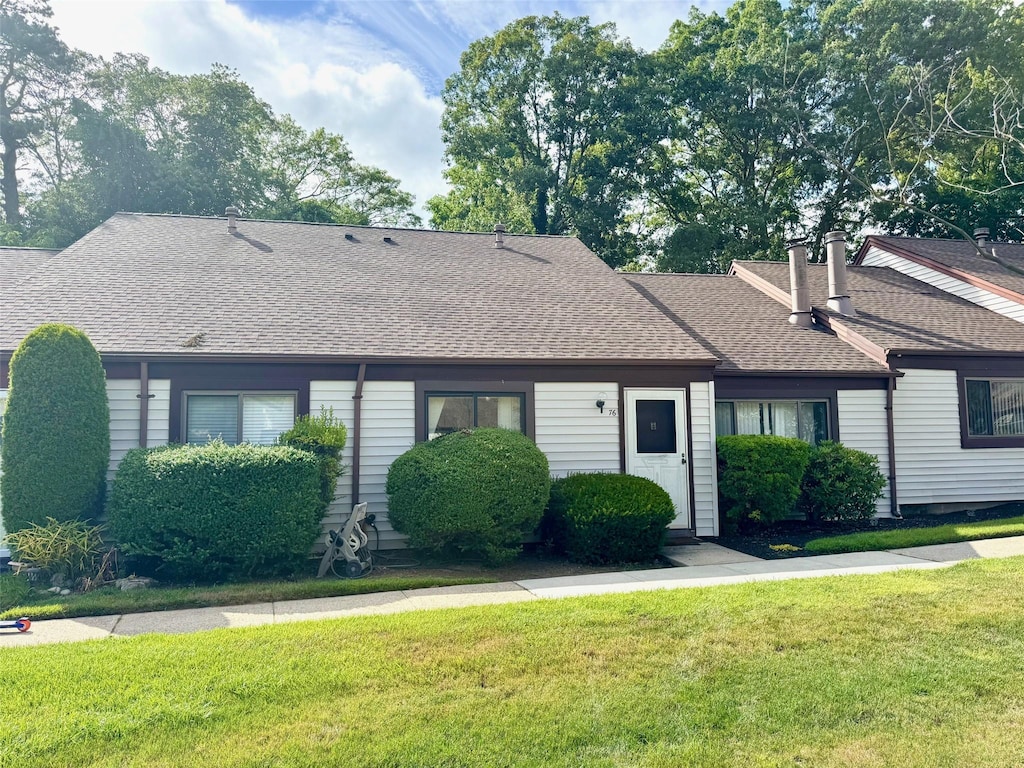 76 Gauguin Unit 76, Middle Island, NY 11953 - view of front of property with a front yard and a shingled roof