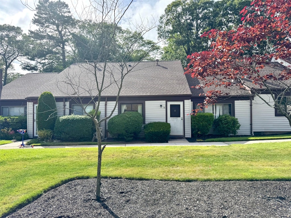 76 Gauguin Unit 76, Middle Island, NY 11953 - view of front of property with a front yard and a shingled roof