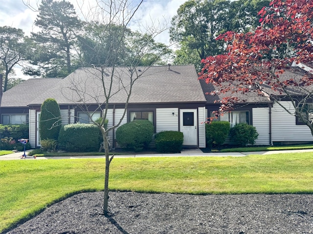 76 Gauguin Unit 76, Middle Island, NY 11953 - view of front of property with a front yard and a shingled roof