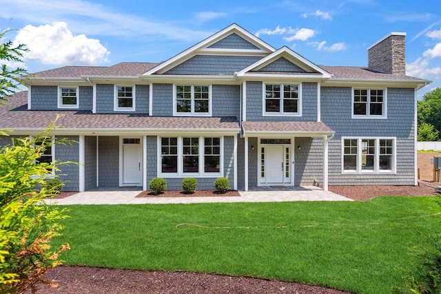 46 Plainview Rd, Woodbury, NY 11797 - shingle-style home with a chimney, a front yard, and a shingled roof