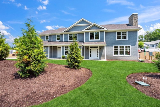 46 Plainview Rd, Woodbury, NY 11797 - back of house with a chimney, a lawn, and a shingled roof