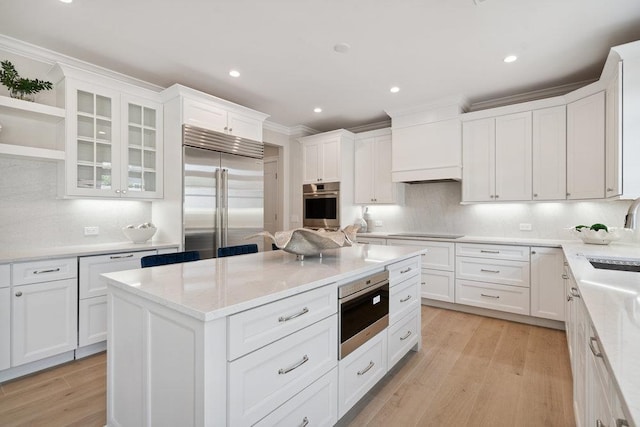 46 Plainview Rd, Woodbury, NY 11797 - kitchen with stainless steel appliances, white cabinetry, ornamental molding, tasteful backsplash, and recessed lighting