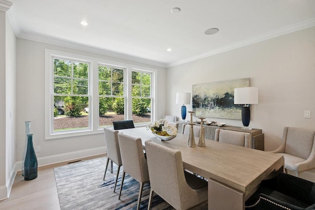 46 Plainview Rd, Woodbury, NY 11797 - dining space featuring wood finished floors, crown molding, and recessed lighting