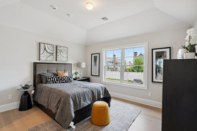 46 Plainview Rd, Woodbury, NY 11797 - bedroom featuring wood finished floors and lofted ceiling