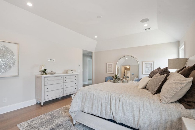 46 Plainview Rd, Woodbury, NY 11797 - bedroom with wood finished floors, recessed lighting, and vaulted ceiling