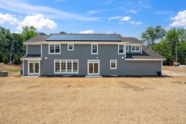 46 Plainview Rd, Woodbury, NY 11797 - back of property featuring roof mounted solar panels and roof with shingles