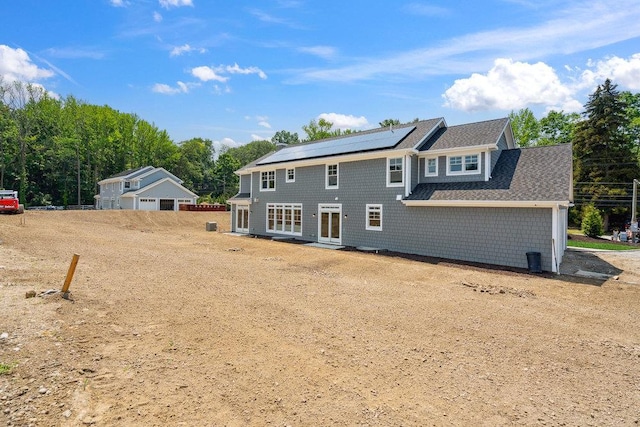 46 Plainview Rd, Woodbury, NY 11797 - back of property with roof mounted solar panels and roof with shingles