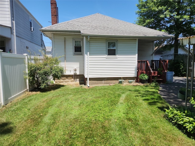 14 W Argyle St, Valley Stream, NY 11580 - rear view of house featuring roof with shingles