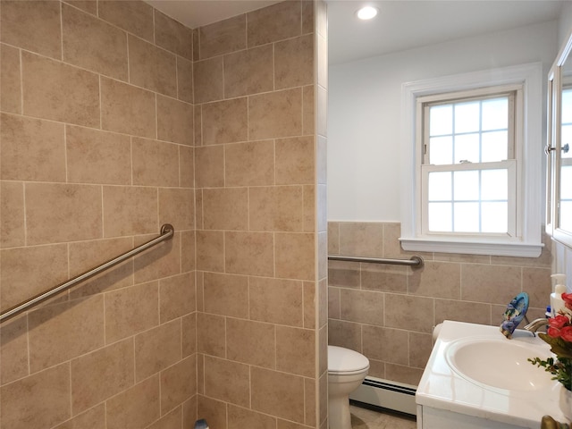 14 W Argyle St, Valley Stream, NY 11580 - bathroom featuring baseboard heating, vanity, tile walls, a shower, and recessed lighting