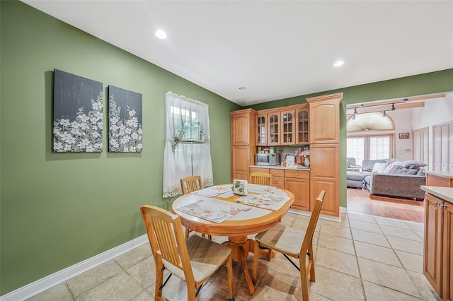8624 253rd St, Bellerose, NY 11426 - dining room with light tile patterned floors and recessed lighting