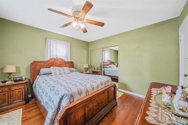 8624 253rd St, Bellerose, NY 11426 - bedroom featuring wood finished floors, a ceiling fan, and a closet