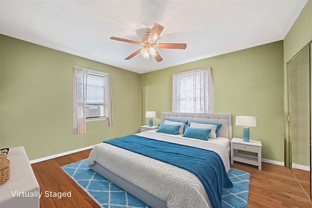 8624 253rd St, Bellerose, NY 11426 - bedroom with wood finished floors, ceiling fan, and cooling unit