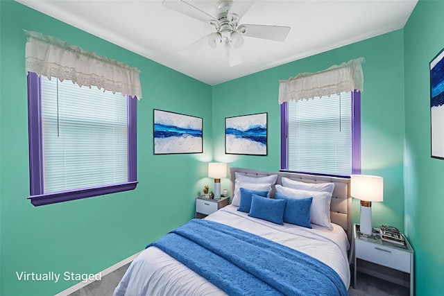 8624 253rd St, Bellerose, NY 11426 - carpeted bedroom featuring multiple windows and a ceiling fan