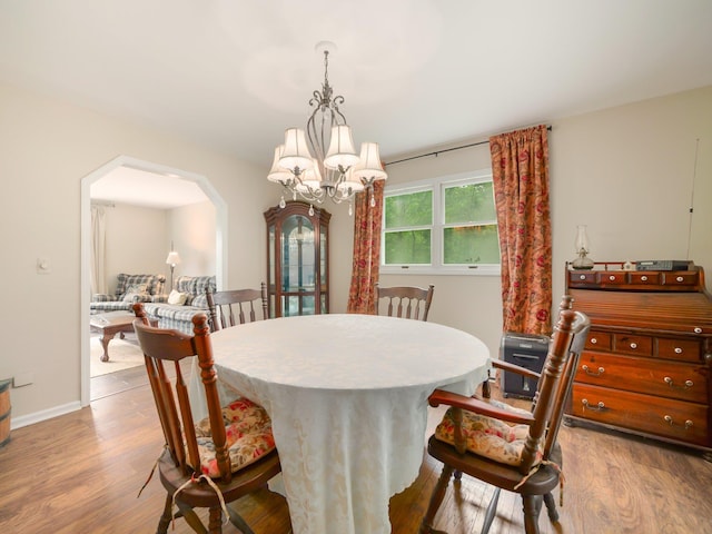 3 Kohler, Middletown, NY 10940 - dining space featuring arched walkways, a chandelier, and wood finished floors