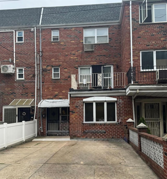62-56 71st St, Middle Village, NY 11379 - back of property featuring brick siding and roof with shingles