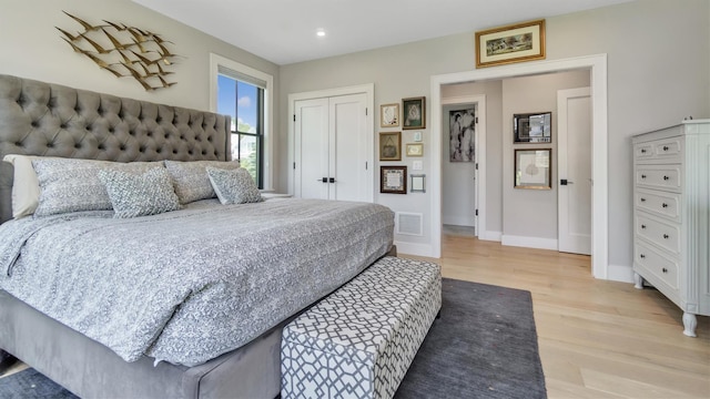 305 Fay Ct, Mattituck, NY 11952 - bedroom with light wood-style floors, recessed lighting, and a closet