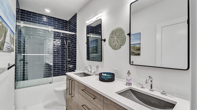 305 Fay Ct, Mattituck, NY 11952 - bathroom featuring shower / bath combination with glass door, double vanity, and marble look tile flooring