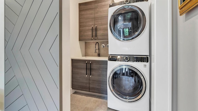 305 Fay Ct, Mattituck, NY 11952 - laundry room featuring cabinet space and stacked washing machine and dryer