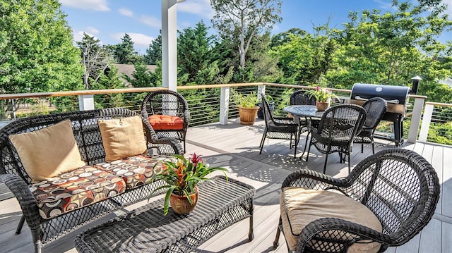 305 Fay Ct, Mattituck, NY 11952 - wooden terrace featuring outdoor dining area, grilling area, and view of wooded area