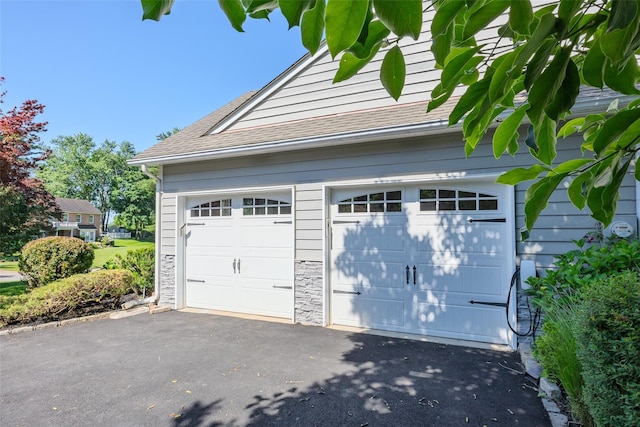 2 White Pine Ln, Setauket, NY 11733 - garage featuring asphalt driveway