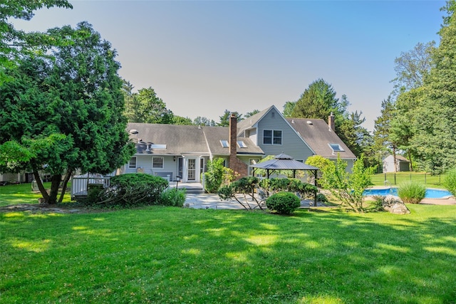 2 White Pine Ln, Setauket, NY 11733 - rear view of property with a gazebo, a chimney, a patio area, and an outdoor pool
