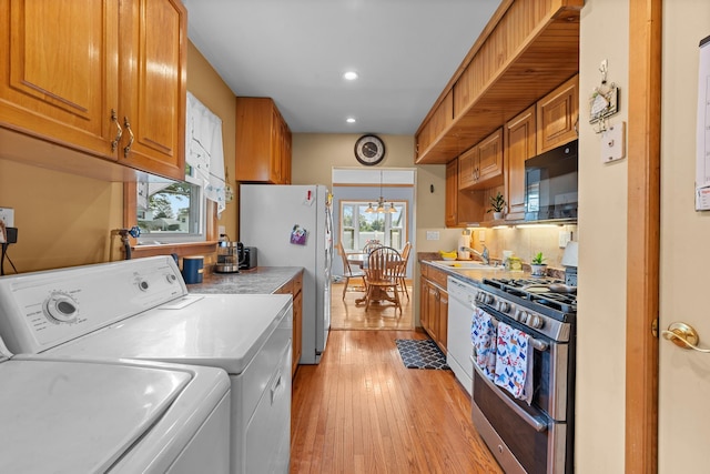 1 Horton Rd, Valley Stream, NY 11581 - kitchen with appliances with stainless steel finishes, washer and clothes dryer, recessed lighting, light countertops, and light wood finished floors
