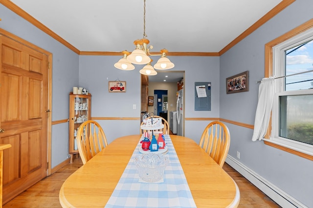 1 Horton Rd, Valley Stream, NY 11581 - dining area featuring a baseboard heating unit, light wood-type flooring, a chandelier, plenty of natural light, and ornamental molding