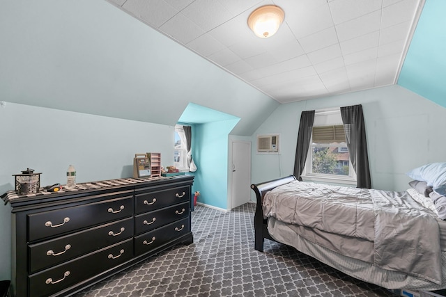 1 Horton Rd, Valley Stream, NY 11581 - bedroom with vaulted ceiling, dark carpet, and a wall mounted air conditioner