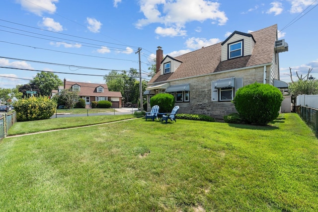 1 Horton Rd, Valley Stream, NY 11581 - back of house featuring a shingled roof, stone siding, and a chimney