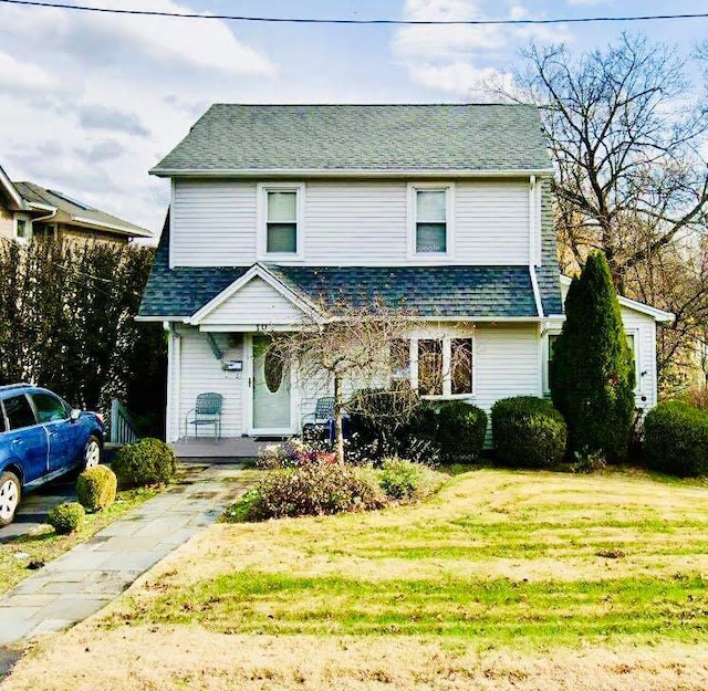 10 Mountain View Ave, Pearl River, NY 10965 - view of front facade with a front yard, covered porch, and a shingled roof
