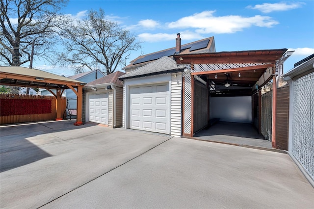 12605 109th Ave, Richmond Hill S, NY 11420 - garage featuring roof mounted solar panels and ceiling fan