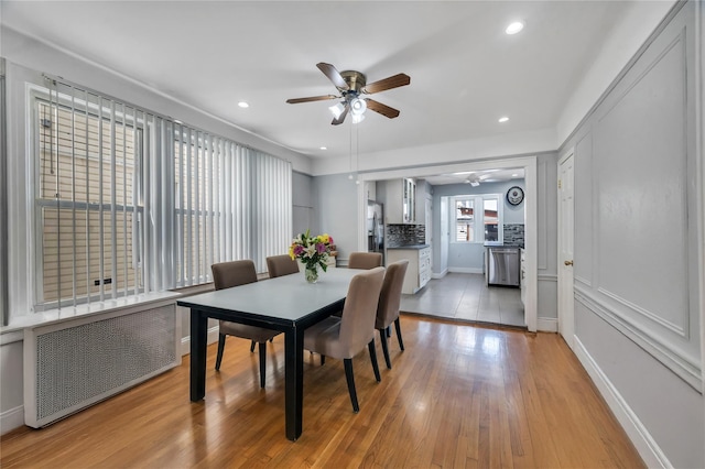 12605 109th Ave, Richmond Hill S, NY 11420 - dining room featuring radiator heating unit, a ceiling fan, light wood finished floors, and recessed lighting
