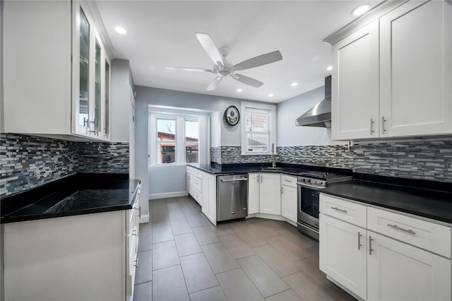 12605 109th Ave, Richmond Hill S, NY 11420 - kitchen featuring appliances with stainless steel finishes, wall chimney range hood, dark countertops, ceiling fan, and tasteful backsplash