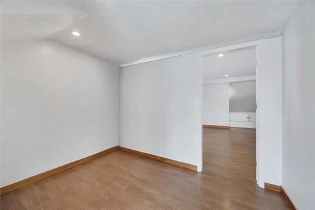 12605 109th Ave, Richmond Hill S, NY 11420 - spare room featuring wood finished floors, recessed lighting, and vaulted ceiling