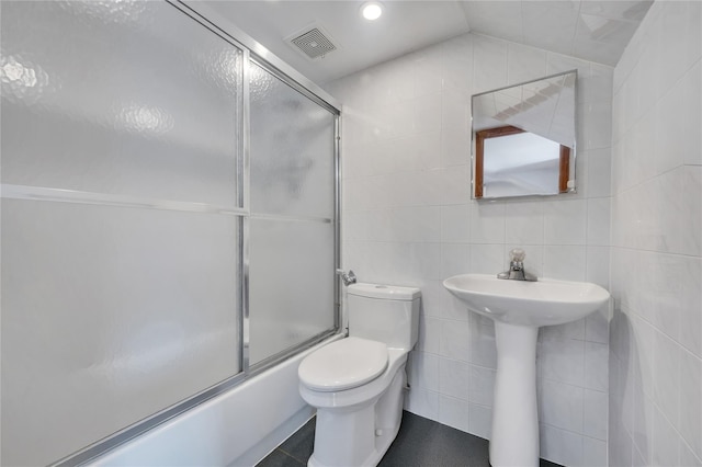 12605 109th Ave, Richmond Hill S, NY 11420 - bathroom with tile walls and shower / bath combination with glass door