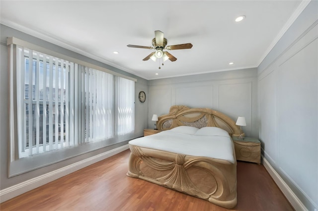 12605 109th Ave, Richmond Hill S, NY 11420 - bedroom featuring multiple windows, a decorative wall, wood finished floors, ornamental molding, and a ceiling fan