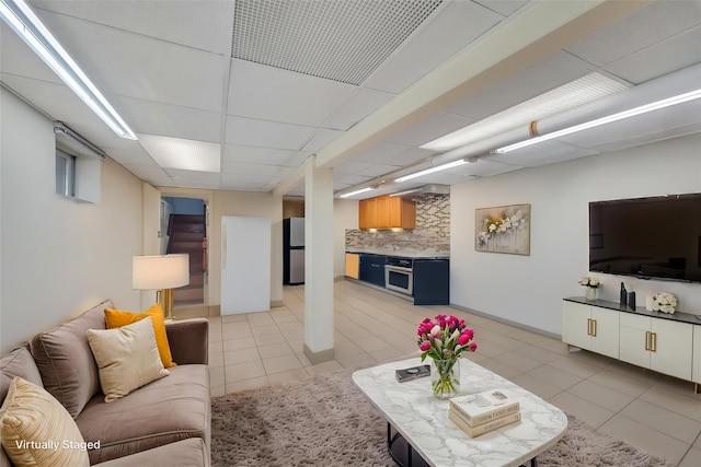 12605 109th Ave, Richmond Hill S, NY 11420 - living room featuring light tile patterned flooring and a paneled ceiling