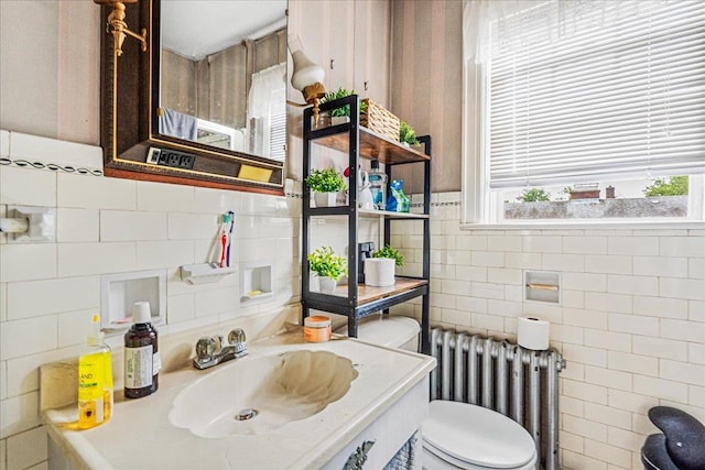 16608 Cryders Ln, Beechhurst, NY 11357 - bathroom featuring radiator, tile walls, and vanity