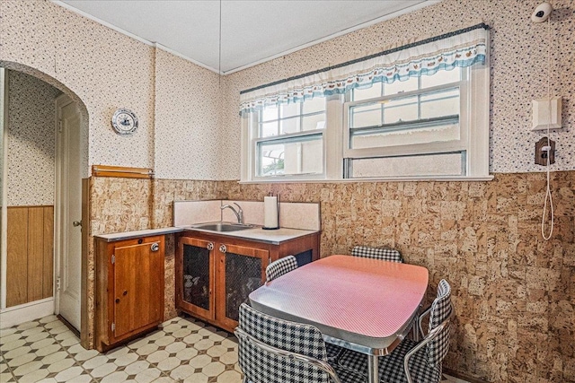16608 Cryders Ln, Beechhurst, NY 11357 - bathroom featuring wallpapered walls, crown molding, a wainscoted wall, and tile patterned floors