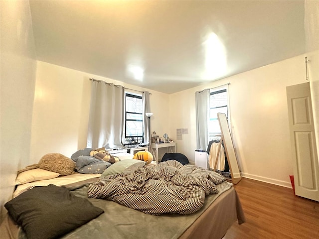 4233 Kissena Blvd Unit 2D, Flushing, NY 11355 - bedroom featuring dark wood-style floors and multiple windows