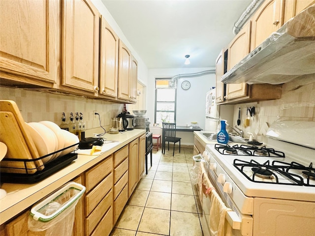 4233 Kissena Blvd Unit 2D, Flushing, NY 11355 - kitchen featuring under cabinet range hood, white appliances, light countertops, light tile patterned floors, and light brown cabinetry