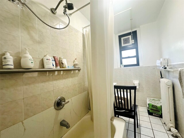 4233 Kissena Blvd Unit 2D, Flushing, NY 11355 - full bathroom featuring tile walls, tile patterned flooring, shower / tub combo with curtain, and radiator heating unit
