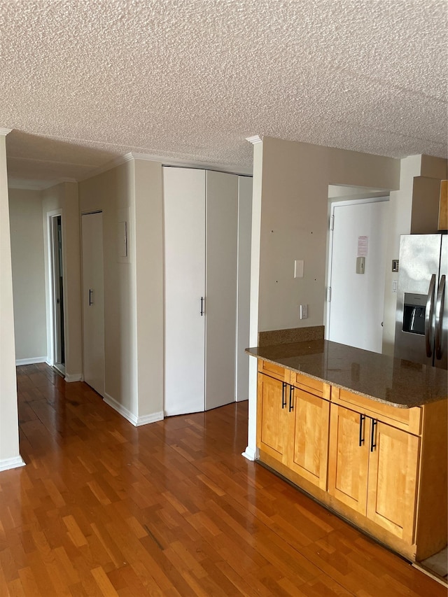 3220 Fairfield Ave Unit 6D, Bronx, NY 10463 - kitchen featuring wood finished floors, a textured ceiling, and stainless steel refrigerator with ice dispenser