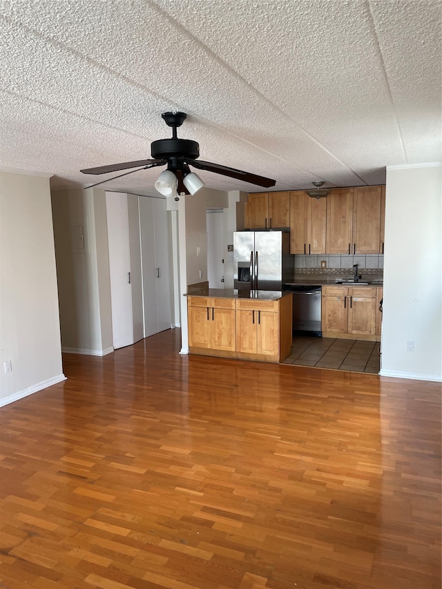 3220 Fairfield Ave Unit 6D, Bronx, NY 10463 - kitchen featuring stainless steel appliances, dark countertops, wood finished floors, and open floor plan
