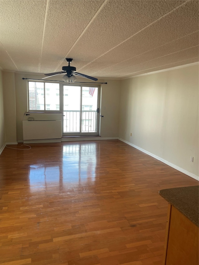 3220 Fairfield Ave Unit 6D, Bronx, NY 10463 - empty room featuring ceiling fan, wood finished floors, and a textured ceiling
